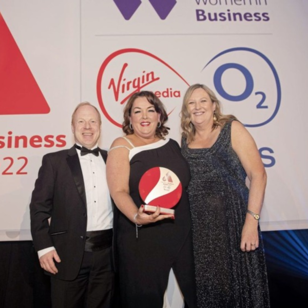 Tina McKenzie posing with her Business Woman of the Year award