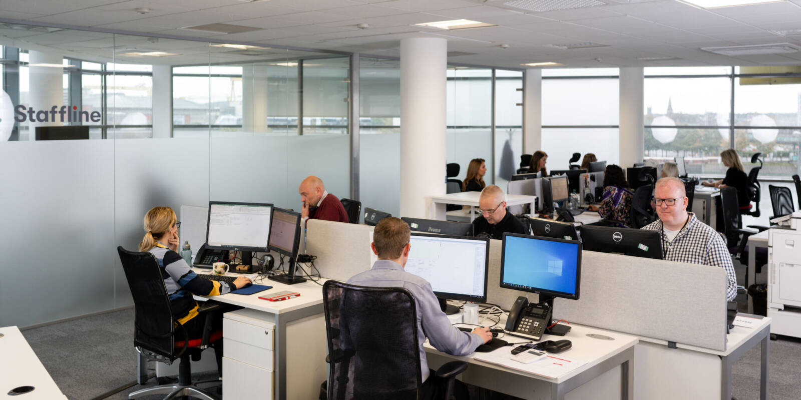 Staffline team members working in the office