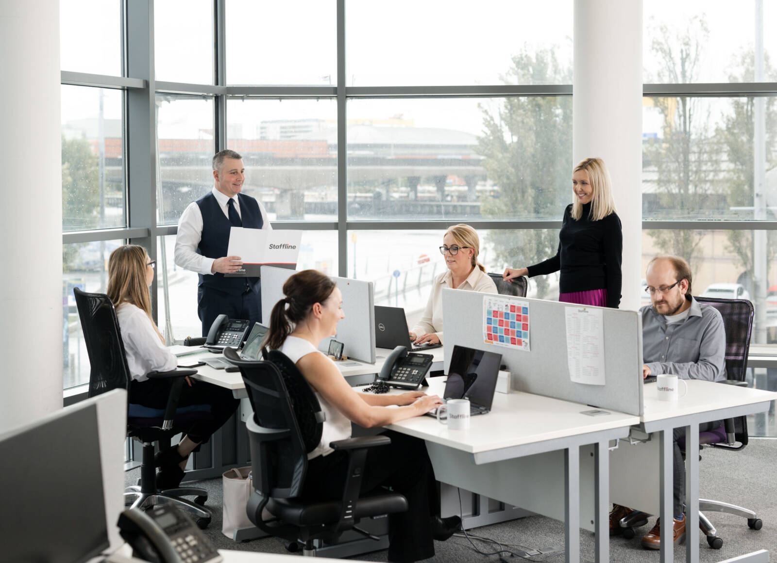 Staffline team members working in their office