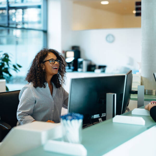 Administrative assistant chatting to customer