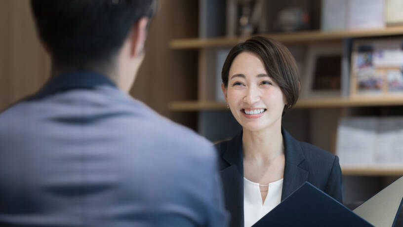 Two people talking and smiling